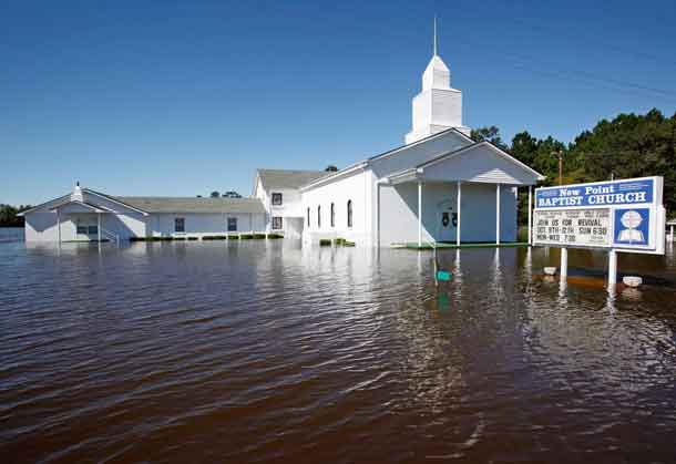 A Baptist church is surrounded by flood waters after Hurricane Matthew hit Lumberton, North Carolina October 9, 2016. REUTERS/Jonathan Drake