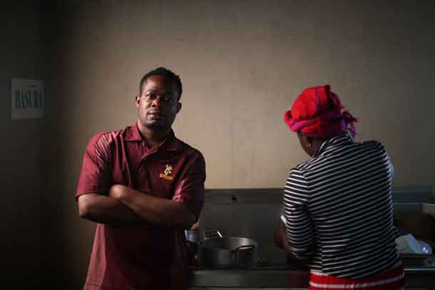 Haitian migrant, Normilus Mondesir, 38, poses for a photo inside the kitchen of the Juventud 2000 shelter after leaving Brazil, where he relocated to after Haiti's 2010 earthquake, in Tijuana, Mexico, October 7, 2016. REUTERS/Edgard Garrido