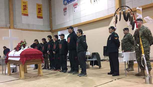 Junior Canadian Rangers stand behind Junior Ranger Garrett Tomagatick's coffin. credit: Master Corporal Vicky Edwards, Canadian Rangers