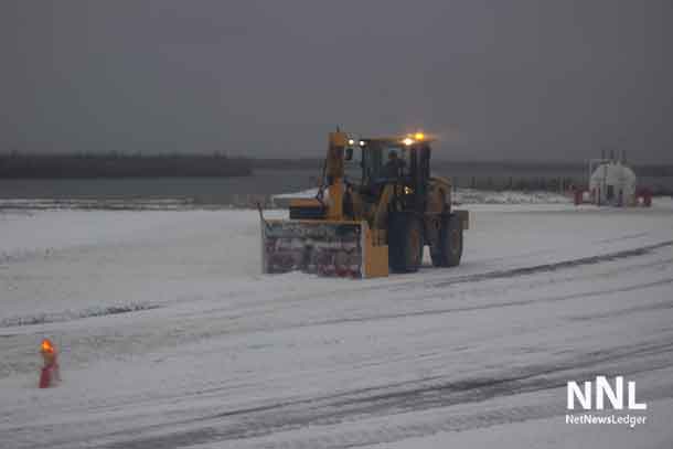 The task of clearing snow from runways in the North is a full time task. Here in Kasabonika the snowblower is working to keep the runway smooth and safe.