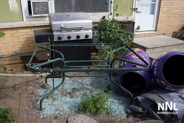 The backyard of Unit 16 in Windsor, home of the Community Action Group. The broken window was replaced, but the broken glass left where it presents a danger and a liability