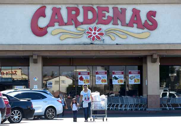 Customers exit Cardenas supermarket, where an advance polling station for the U.S. presidential election was allowed to remain open late on November 4, in a east side neighborhood of Las Vegas, Nevada, U.S. November 8, 2016.  REUTERS/David Becker