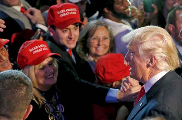 Republican U.S. presidential nominee Donald Trump greets supporters at his election night rally in Manhattan, New York, U.S., November 9, 2016. REUTERS/Carlo Allegri