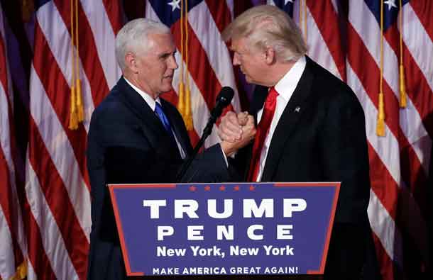 Donald Trump greets his running mate Mike Pence during his election night rally in Manhattan. REUTERS/Mike Segar