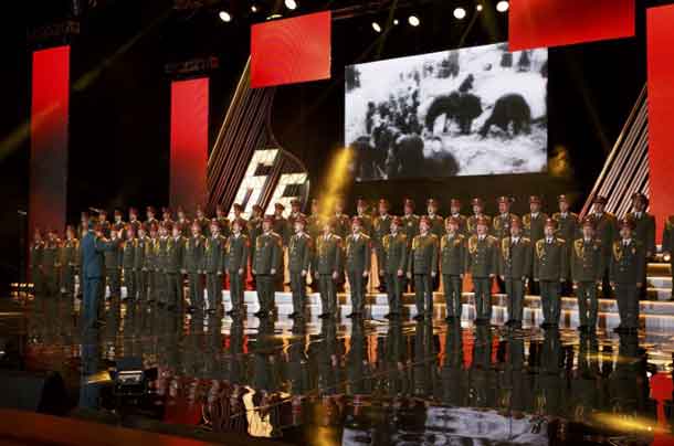 FILE PHOTO: Singers and orchestra members of Red Army Choir, also known as the Alexandrov Ensemble, perform in Moscow, Russia March 31, 2016. REUTERS/Stringer/File Photo