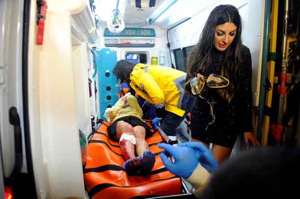 An injured woman is carried to an ambulance from a nightclub where a gun attack took place during a New Year party in Istanbul, Turkey, January 1, 2017. Murat Ergin/Ihlas News Agency via REUTERS