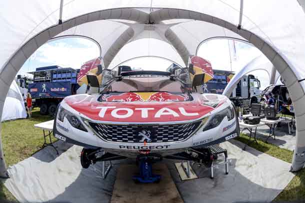 A Team Peugeot TOTAL race car being prepared in the service area for the Dakar Rally 2017 in Asuncion, Paraguay on december 31, 2016 // Marc Bow/Red Bull Content Pool // P-20161231-00136 // Usage for editorial use only // Please go to www.redbullcontentpool.com for further information. //