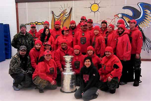 Canadian Rangers pose with the Stanley Cup in Sandy Lake First Nation.