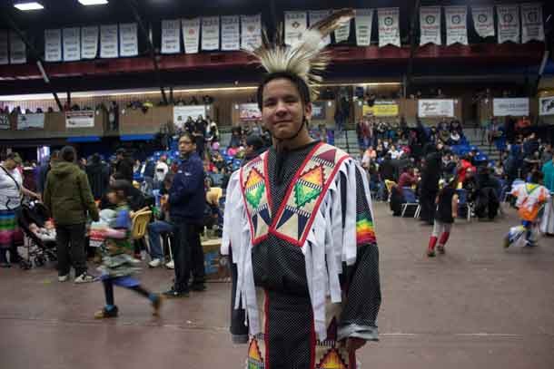 Munzeroy celebrates at the LUNSA Pow Wow. This young man has been following the Pow Wow trail for many years.