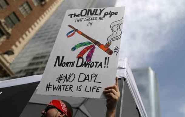 People protest against President Donald Trump's executive order fast-tracking the Keystone XL and Dakota Access oil pipelines in Los Angeles, California, U.S., March 10, 2017. REUTERS/Lucy Nicholson