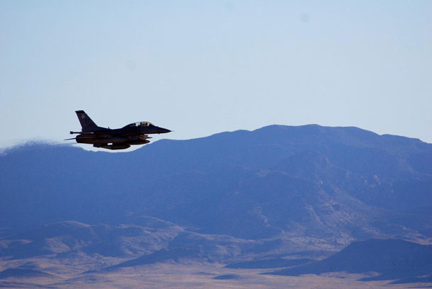 An F-16C makes a pass over Nevada's Tonopah Test Range after a March test of a mock nuclear weapon as part of a Sandia National Laboratories life extension program for the B61-12. Teams will spend months analyzing the data gathered from the test. CREDIT: Sandia National Laboratories/Photo by James Galli