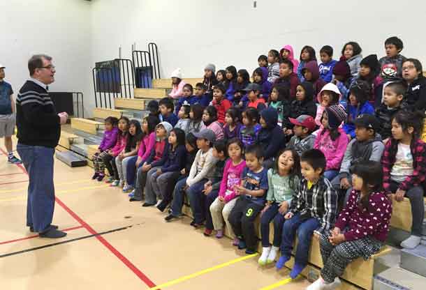 Kenora MP Bob Nault talking to the young in Fort Hope.