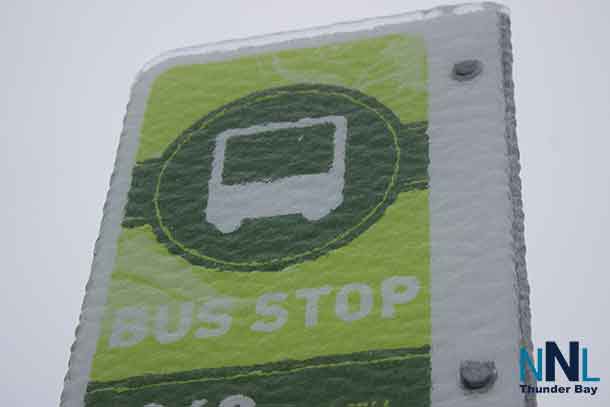 Thunder Bay Transit sign encased in ice.