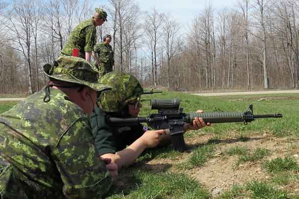 Junior Canadian Ranger Claudia Albany shoots with the army's C7 assault rifle.