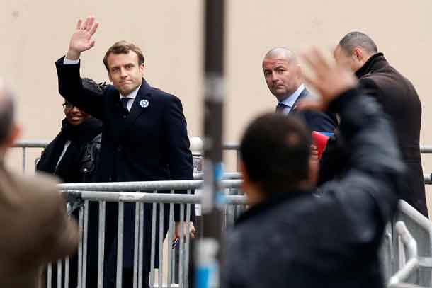 French President elect Emmanuel Macron waves as he arrives at his campaign headquarters in Paris, France, May 8, 2017. REUTERS/Gonzalo Fuentes