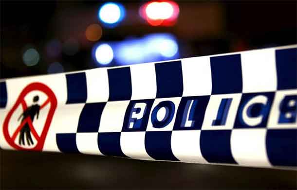 Police tape stretches across a road as police inspect and guard the area outside the New South Wales (NSW) state police headquarters located in the south western Sydney suburb of Parramatta, Australia, October 2, 2015. REUTERS/David Gray