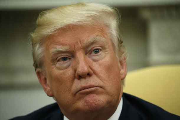 U.S. President Donald Trump listens to questions from the media as he meets with Colombia's President Juan Manuel Santos (not pictured) in the Oval Office in Washington, DC, U.S., May 18, 2017. REUTERS/Kevin Lamarque