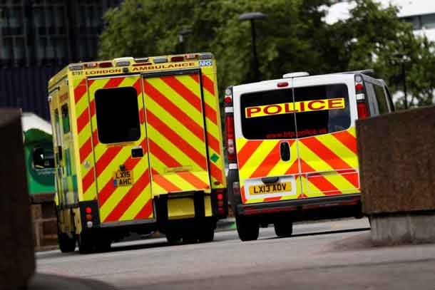 An ambulance waits next to a police car, outside the emergency department, at St Thomas' Hospital in central London, Britain May 12, 2017.  REUTERS/Stefan Wermuth