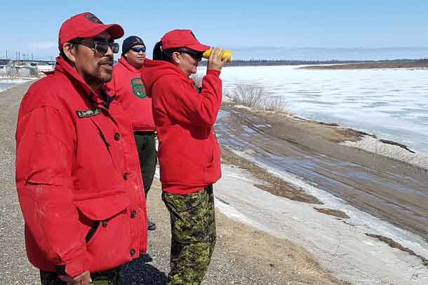 Canadian Rangers monitoring the ice and water levels on the Albany River at Kashechewan are Master Corporal Robert Wynne, of Kashechewan, and Rangers Leonard Beaver and Jessie  Wabasse, both from Webequie. Credit ergeant Richard Mifflin, Canadian Army