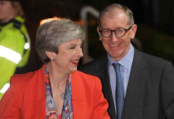 Britain's Prime Minister Theresa May and her husband Philip arrive at the count centre for her seat for the general election in Maidenhead, June 9, 2017. REUTERS/Toby Melville