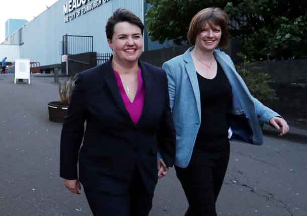 Ruth Davidson, leader of the Scottish Conservatives, leaves the counting centre for Britain's general election with her partner Jen Wilson in Edinburgh, Scotland, June 9, 2017. REUTERS/Russell Cheyne