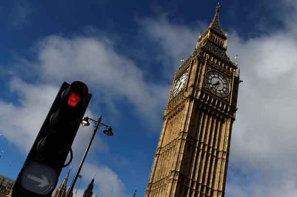 A red traffic light is seen next to Big Ben, in Westminster, central London, Britain, June 9, 2017. REUTERS/Clodagh Kilcoyne