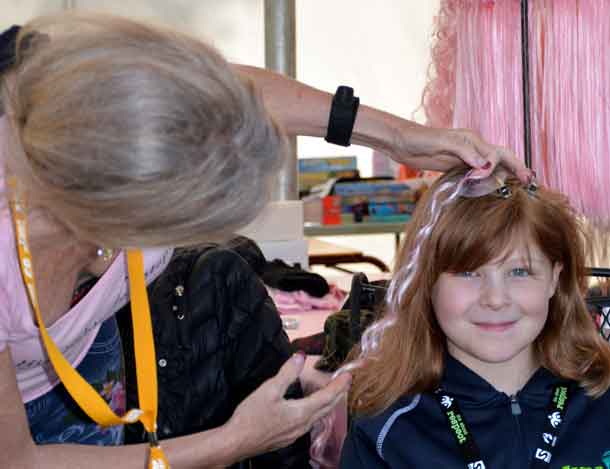 Camper Nevaya getting a pink highlight in her hair!