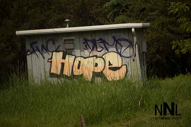 Graffiti on a building at McVicars Creek near where police found Kevin Roundhead