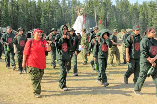 A Canadian Rangers leads Junior Canadian Rangers to a training site at last year's Camp Loon.