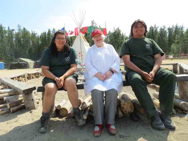 Ontario Lieutenant-Governor Elizabeth Dowdeswell, centre, with two Junior Canadian Rangers, Nova Gull, 16, of Peawanuck, and Trevor McKay, 17, of Kitchenuhmaykoosib, who were appointed as her honorary aides de camp for her visit to Camp Loon.