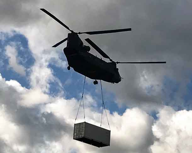 A Royal Canadian Air Force Chinook helicopter delivers a sea container to Nibinamik to store Canadian Ranger supplies and equipment.