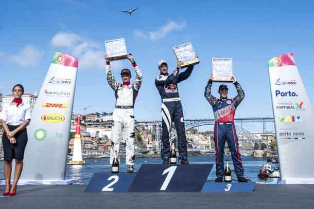 Martin Sonka of the Czech Republic (C) celebrates with Pete McLeod of Canada (L) and Matt Hall of Australia (R) during the Award Ceremony at the sixth round of the Red Bull Air Race World Championship in Porto, Portugal on September 3, 2017. // Mihai Stetcu/Red Bull Content Pool