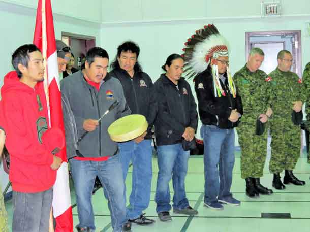 An honour song is sung for the new Canadian Ranger patrol in Nibinamik. - Photo SGT. Peter Moon