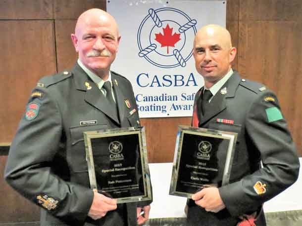 Chief Warrant Officer Robert Patterson, left, and Warrant Officer Carl Wolfe with special recognition awards for promoting boat and water safety in the First Nations of the Far North of Ontario.