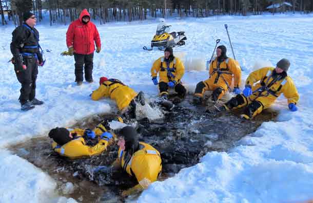 Rangers wear immersion suits while learning ice water rescue techniques. Photo by Sgt. Peter Moon