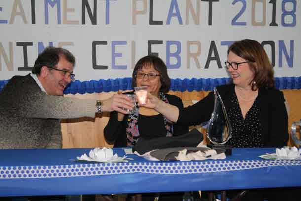 Kenora MP Bob Nault, Slate Falls Chief Lorraine Crane, and Minister of Indigenous Services Jane Philpott, cheers glasses of clean water during a celebratory luncheon at Bimaychikamah School in Slate Falls First Nation following the grand opening of the community's new water treatment plant on Tuesday, March 12, 2018.