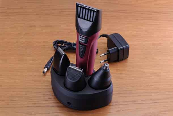 Stylish Electrical Hair Barber Clippers, Haircut accessories on wood background with copy space Image - Depositphotos.com
