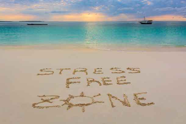 i wrote this message in Nungwi beach in Zanzibar,Tanzania.This is paradice for no Stress! Image - deposit photos.com