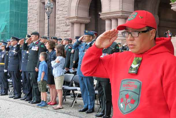 Corporal Terrence Duncan salutes at change of command ceremony.