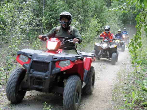 Junior Canadian Rangers end a day of training with a trail ride.