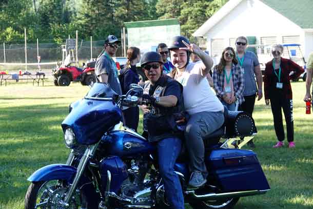 Camper Alyx getting ready to hit the road on a Harley.