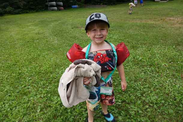 Camper Parker ready to dive into the lake with his fabulous swimming outfit.
