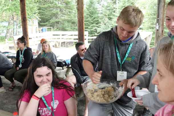 Campers Alyx, Braeden, and Katelyn mixing up a batch of cookies – YUM!