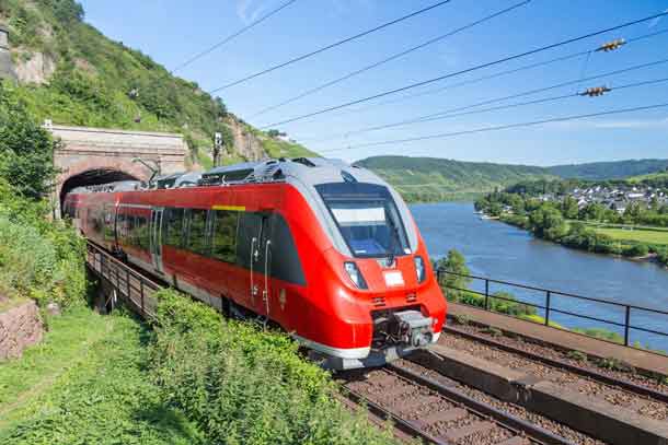 Intercity train leaving a tunnel near the river Moselle in Germany - Image Depositphotos.com