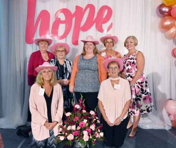 The Tbaytel Luncheon of Hope Committee (back, L-R) Barb Midgley, Deb Saunders, Devon Sokoloski from the Health Sciences Foundation, Barb Sanderson, (front) Lynn Tapak, and Sue Childs, pictured here with 7-year emcee Katie Crowe (far right).
