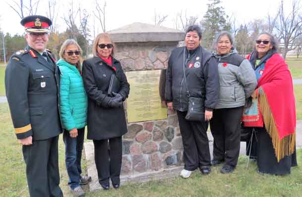Brigadier-General Jocelyn Paul, left, with granddaughters of Sergeant Francis Pegahamagabow at a cairn honouring him as Canada's most highly decorated Indigenous soldier. They are, from left, Theresa McInnes, Karen Pegahmagabow, Eva Jane Poytress, Robin Pegahmagabow, and Laura Pegahmagabow. Photo by Sgt Peter Moon