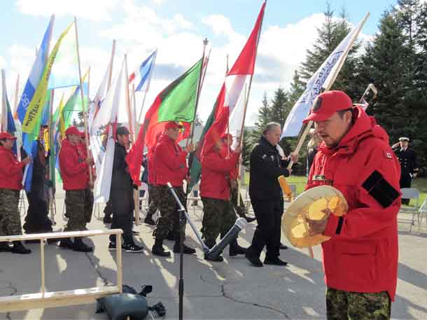 Ranger Howard Jacob of Webequie drums as Grand Entry enters the circle. Photo by Sgt Peter Moon