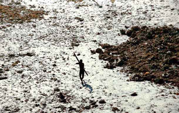 This member of the Sentinelese tribe was photographed firing arrows at a helicopter which was sent to check up on the tribe in the wake of the 2004 tsunami . The Sentinelese people have long made it clear that outsiders are not welcome and they wish to be left alone. © Indian Coastguard/Survival