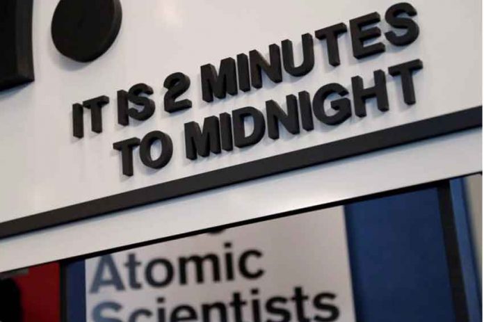 The updated time designation is visible underneath the ‘Doomsday Clock’ during a news conference” in Washington, U.S., January 25, 2018. REUTERS/Leah Millis