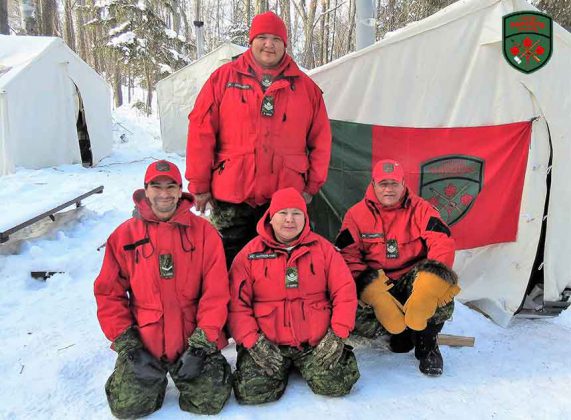 Four Canadian Rangers who passed on survival kills were, kneeling from left, Ranger Richard Yellowhead, Master Corporals Yvonne Sutherland and Joe Lazarus, and, standing, Master Corporal Bradley Anderson. Photo by Sgt Peter Moon